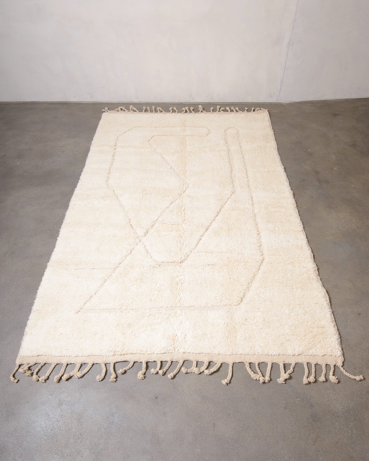 Modern, designer, handcrafted Berber rug from Morocco. Beniourain carpet with minimalist design, natural wool pile and a fluffy texture.